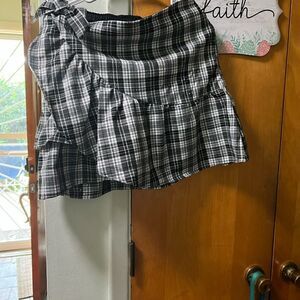 Kidpik Plaid Skirt with attached shorts and bow detail; zipper closure